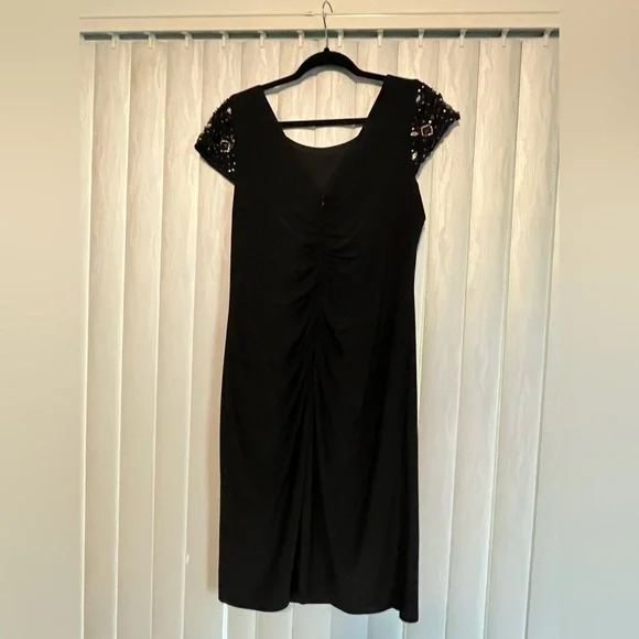 Elegant Black Dress with Embellished Sleeves - Picture 5 of 10